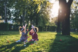 Kids playing in woodland area. Easter holiday breaks 